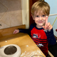 A little boy shows off a dollop of egg-free frosting